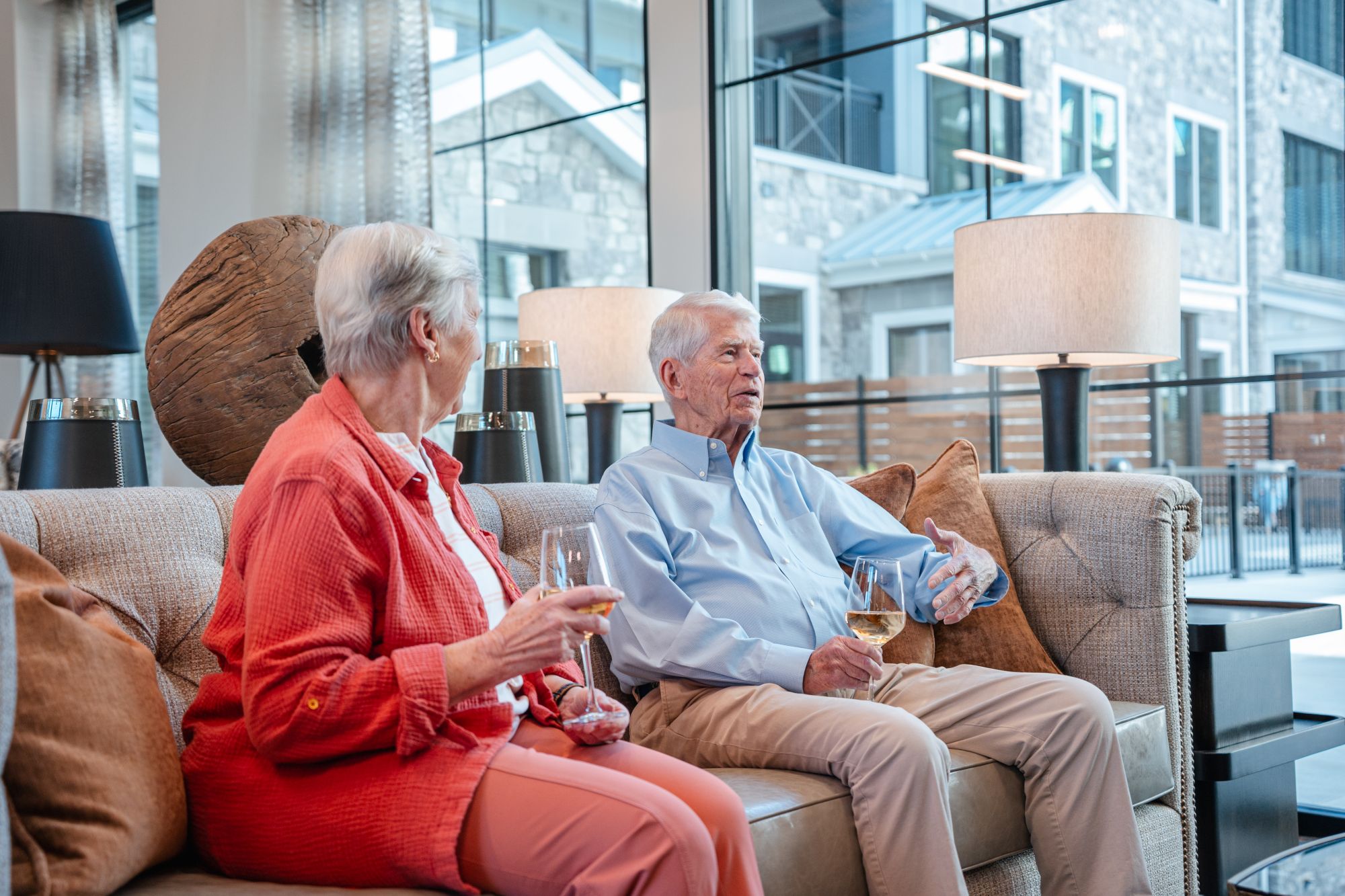 seniors talking on couch